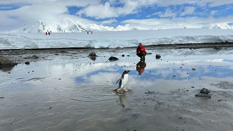 The writer’s son and a Gentoo penguin at Damoy Point